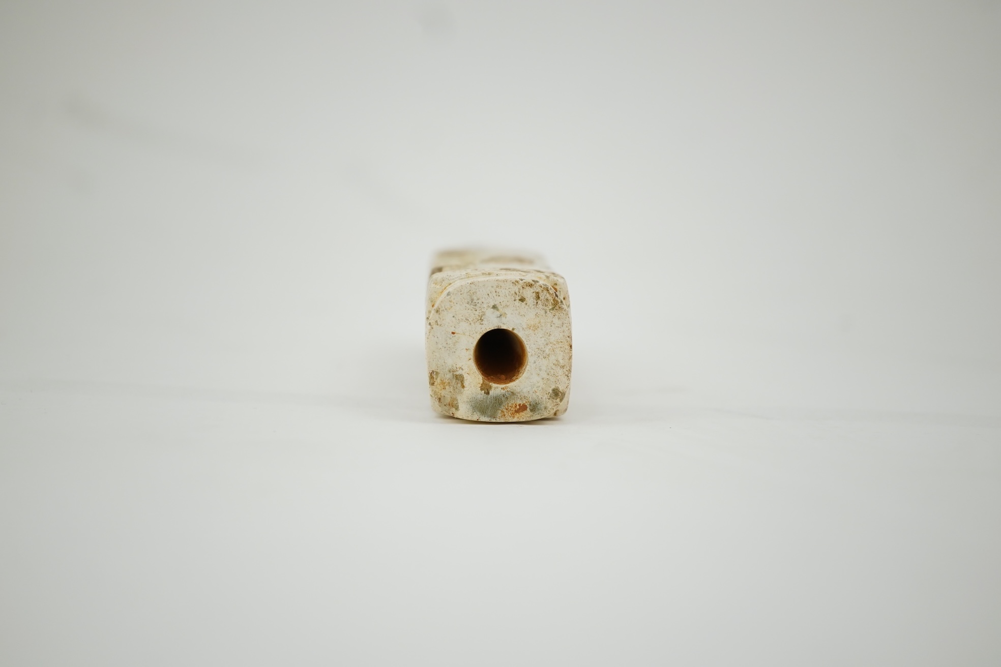 Four Chinese archaistic hardstone or burnt jade cong or cylinders